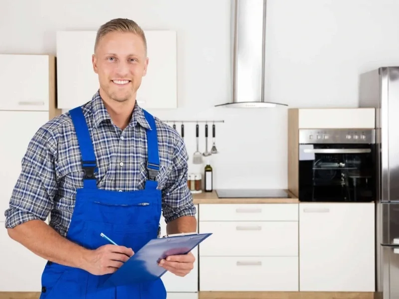 Appliance Installation technician is holding clipboard