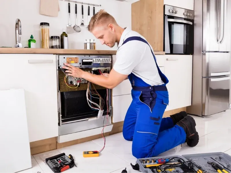 Home Appliance Repair Technician at work